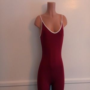 Burgundy jumpsuit, trimmed in white